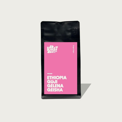 Coffee bag with pink label featuring 'Ethiopia Gui Geleña Geisha' on a light gray background